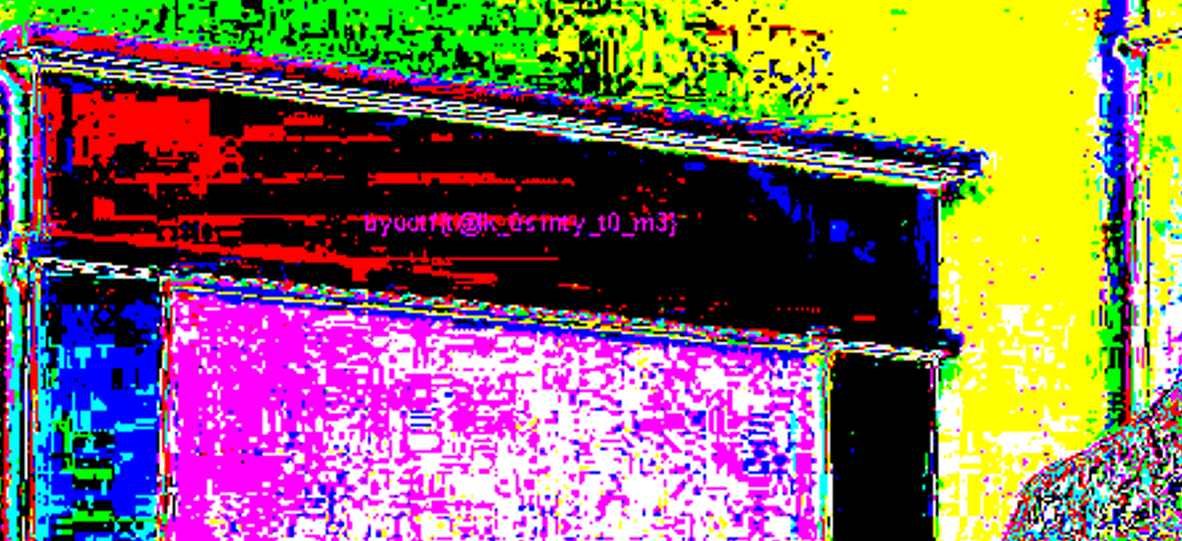 A randomly color-mapped version of the picture, zoomed in to the window frame, a line of magenta text can be found on the picture which says the flag.